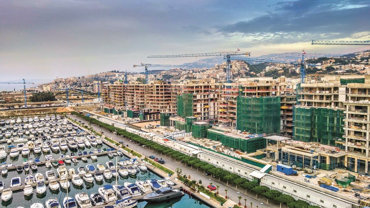 Urban buildings and dramatic sky symbolizing periods of conflict and reconstruction